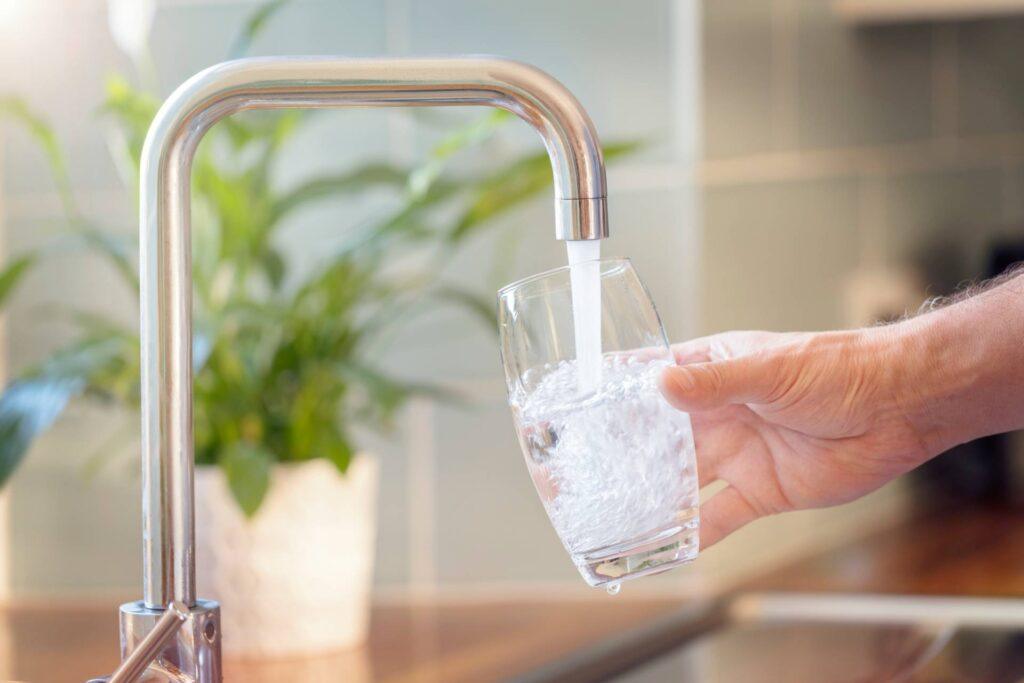filling a glass with tap water