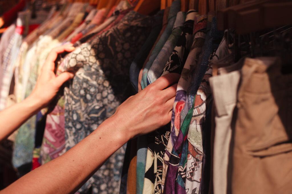 mixture of clothes on rail